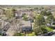 Aerial view showcases the neighborhood and a beautiful green space with mountain views in the distance at 2557 S Dover St # 12, Lakewood, CO 80227