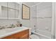 Bathroom featuring tiled shower and updated vanity at 2557 S Dover St # 12, Lakewood, CO 80227