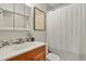 This bathroom boasts a shower with a new glass shower door at 2557 S Dover St # 12, Lakewood, CO 80227
