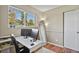 Bedroom used as office space with big window and hardwood floors at 2557 S Dover St # 12, Lakewood, CO 80227