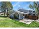A lovely house featuring a well-kept lawn, complemented by a backyard patio and a wooden fence at 2557 S Dover St # 12, Lakewood, CO 80227