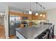 Well-lit kitchen with stainless steel appliances, modern backsplash, and ample counter space at 2557 S Dover St # 12, Lakewood, CO 80227