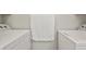 Laundry room with modern washer and dryer units at 2557 S Dover St # 12, Lakewood, CO 80227