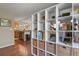 Open concept living area with stylish shelving dividing the space and modern kitchen in view at 2557 S Dover St # 12, Lakewood, CO 80227