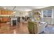 Inviting living space featuring hardwood floors, comfortable seating, and an open layout to the kitchen at 2557 S Dover St # 12, Lakewood, CO 80227