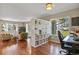 Bright living space with divider, comfortable seating, and home office area with natural light at 2557 S Dover St # 12, Lakewood, CO 80227