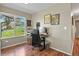 Functional home office with wood floors, natural light, and a comfortable workspace at 2557 S Dover St # 12, Lakewood, CO 80227