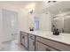 Bright bathroom featuring double vanity with modern fixtures and a glass-enclosed shower, providing a clean and stylish look at 352 N. Geneva St, Aurora, CO 80010