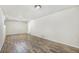 Basement with modern vinyl floors and neutral walls, with an open floor plan at 14797 E Temple Dr, Aurora, CO 80015