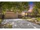 Charming one story house with a two-car garage, brick accents and mature trees in the front yard at 14797 E Temple Dr, Aurora, CO 80015