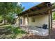 Outdoor patio with wood pergola, gas connection, stone pavers, and backyard access for entertaining guests at 14797 E Temple Dr, Aurora, CO 80015