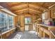 This large interior shed view features a window bench and spacious unfinished workspace, perfect for storage at 14797 E Temple Dr, Aurora, CO 80015