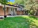Spacious backyard featuring a well-maintained lawn, patio area, and second story deck, great for outdoor activities at 11351 Quivas Way, Denver, CO 80234