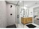 Modern bathroom featuring tiled shower with seat, dual-sink vanity, and sleek finishes at 11351 Quivas Way, Denver, CO 80234