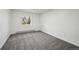 Bedroom has gray carpet, white walls and trim, plus natural light from the window at 11351 Quivas Way, Denver, CO 80234