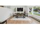 Stylish dining room featuring modern decor, wood floors, and abundant natural light at 11351 Quivas Way, Denver, CO 80234