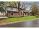 Charming two-story home with a brick facade and well-maintained lawn provides pleasing curb appeal at 11351 Quivas Way, Denver, CO 80234