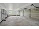 Large garage with high ceilings and multiple doors, offering ample parking and storage space at 11351 Quivas Way, Denver, CO 80234