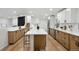 Spacious kitchen featuring stainless steel appliances and an island with barstool seating at 11351 Quivas Way, Denver, CO 80234