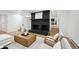Open concept living room with brick fireplace, wood floors, and comfortable seating at 11351 Quivas Way, Denver, CO 80234