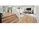 Spacious living room showcasing wood floors, modern decor, and an open floor plan at 11351 Quivas Way, Denver, CO 80234