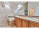 Bathroom featuring a large soaking tub, double vanity, and tiled floors at 22834 E Davies Dr, Aurora, CO 80016