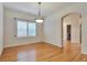Bright dining room featuring wood flooring and natural light at 22834 E Davies Dr, Aurora, CO 80016