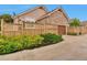 Charming home with a stone and siding exterior, a fence, and mature landscaping at 22834 E Davies Dr, Aurora, CO 80016