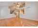 Living room featuring hardwood floors, stairs to the second floor, and views to the kitchen at 22834 E Davies Dr, Aurora, CO 80016