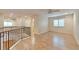 Loft featuring hardwood floors and wrought iron railing at 22834 E Davies Dr, Aurora, CO 80016