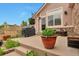 Relaxing outdoor patio with built-in seating, barbecue, and manicured landscaping at 22834 E Davies Dr, Aurora, CO 80016