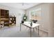 Staged bedroom showcasing a desk, shelving, and a neutral color scheme at 9823 Salford Ln, Highlands Ranch, CO 80126