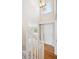 Bright entryway with hardwood floors, high ceilings, and a staircase at 9823 Salford Ln, Highlands Ranch, CO 80126