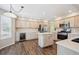 Bright kitchen with ample counter space, stainless steel appliances, and a center island at 9823 Salford Ln, Highlands Ranch, CO 80126