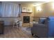 Cozy basement living area with fireplace, comfortable seating, and modern decor at 17671 E Brown Cir, Aurora, CO 80013