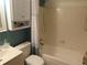 Bathroom featuring shower-tub combination, toilet, vanity, and storage cabinet at 17671 E Brown Cir, Aurora, CO 80013