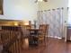 Dining area featuring wood table, chairs, and natural light, ideal for Gathering meals at 17671 E Brown Cir, Aurora, CO 80013