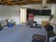 Spacious garage with ample storage, painted floors, and visible mechanics equipment at 17671 E Brown Cir, Aurora, CO 80013