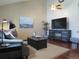 Comfortable living room featuring stylish decor, a fireplace, and plenty of natural light at 17671 E Brown Cir, Aurora, CO 80013