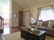 Cozy living room with a comfortable sofa and large window providing natural light at 17671 E Brown Cir, Aurora, CO 80013
