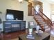 Living room showcasing a wooden staircase and a fireplace, perfect for relaxation and entertaining at 17671 E Brown Cir, Aurora, CO 80013