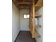 Unfinished storage area with shelves and a small window at 17671 E Brown Cir, Aurora, CO 80013