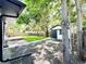 Landscaped backyard featuring a shed, a well-maintained lawn, and mature trees at 8873 Princeton St, Westminster, CO 80031