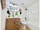 Clean bathroom with wood vanity, black hardware, and decorative wood art on walls at 8873 Princeton St, Westminster, CO 80031