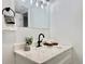 Powder room features a white countertop, black hardware, and stylish decorations at 8873 Princeton St, Westminster, CO 80031