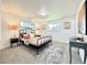 Cozy bedroom features a metal bed frame, neutral tones, and an accent rug on top of the carpet at 8873 Princeton St, Westminster, CO 80031