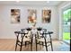 Bright dining area with modern furnishings and contemporary artwork, next to a window providing lots of natural light at 8873 Princeton St, Westminster, CO 80031