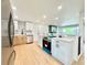 Updated kitchen with stainless steel appliances, white countertop island, and plenty of natural light at 8873 Princeton St, Westminster, CO 80031