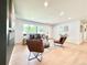 Open-concept living room featuring hardwood floors, a couch and stylish arm chairs at 8873 Princeton St, Westminster, CO 80031