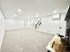 Spacious living room with carpet, a fireplace, and ample natural light at 8873 Princeton St, Westminster, CO 80031